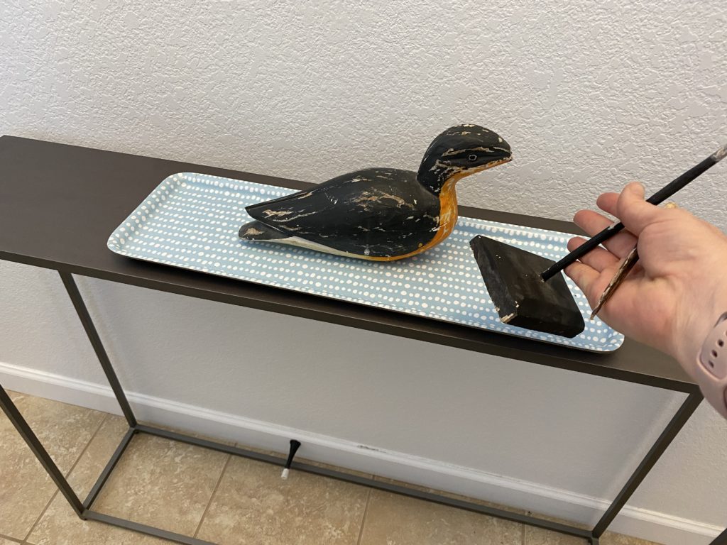 Broken figurine of a water bird